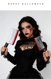 Close-up of gothic spiderweb lace collar and plastic blood-stained toy cleavers