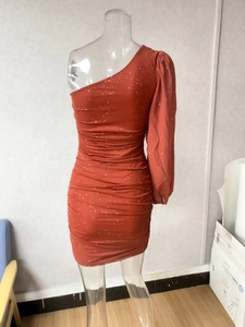 Detail of ruched rust-red one-shoulder sequin mini dress with elegant single long sleeve
