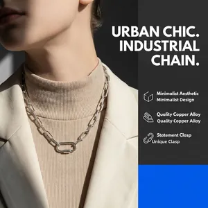 Detail of silver industrial chain necklace with rectangular carabiner clasp on model