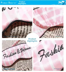 Detail of pink striped satin sleep mask showing elastic headband and soft embroidery