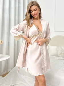 Detailed lace trim on satin nightgown and robe set in soft champagne pink silk