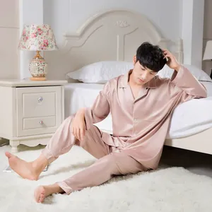 Detail of premium stretch satin men's long sleeve pajamas in elegant champagne gold silk