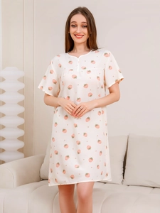 Close-up of lightweight summer nightgown featuring pink strawberry prints and buttoned collar