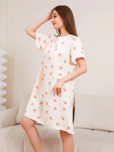 Detail of soft bubble cotton fabric with pink strawberry print on a summer nightgown