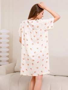 Detail shot of summer nightgown showing strawberry print on soft bubble cotton fabric
