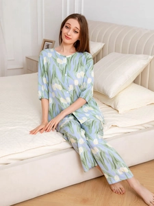 Women's light blue tulip print pajamas set featuring a short-sleeve top and long pants
