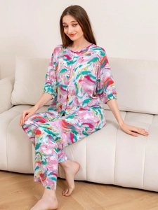 Detail of two-piece pajama set with abstract watercolor print and soft draped fabric