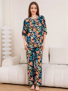 Detail view of women's navy blue floral pajama set with button-front and wide-leg pants