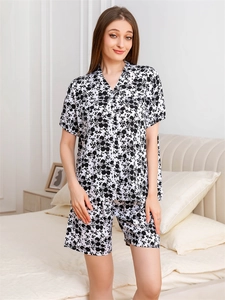 Detail of floral rayon pajama set with short-sleeved V-neck top and matching shorts