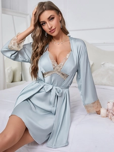 Detail of light blue silk pajama set with delicate lace trim on cuffs and hem