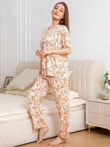Detail of floral rayon pajamas set featuring soft drape and colorful tiny blossom prints