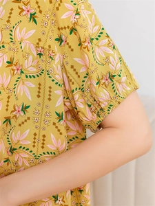 Detail of floral rayon pajama top with elastic cuffs and vibrant summer flower prints