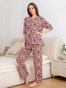 Detail of floral geometric print cotton pajamas with short sleeves and matching trousers