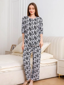 Detail of soft rayon pajamas showing breathable butterfly print fabric on the sleeves