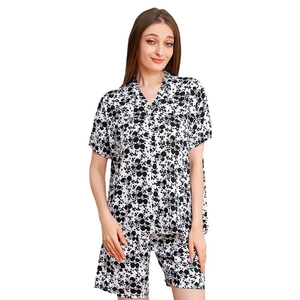Women's two-piece rayon pajama set featuring black and white floral short-sleeved top and shorts