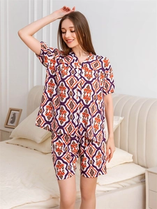 Detail of bohemian geometric print on purple and orange short-sleeved pajama set