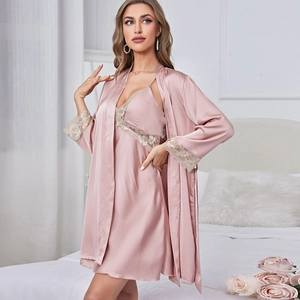 Pink silk satin pajama set with lace trim featuring a slip dress and matching robe