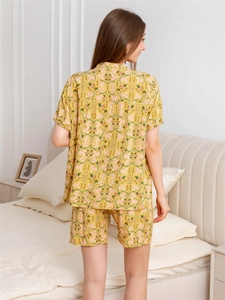 Detail view of rayon pajamas set back profile with yellow floral leaf print for summer comfort