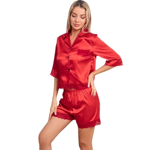 Women's red satin pajama set with lace trim featuring short sleeves and button-down top