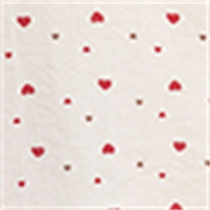 Detailed close-up of cute pink and red heart prints on soft summer loungewear fabric