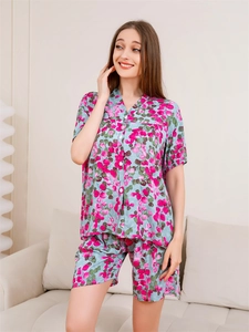 Detail of floral print women's short sleeve pajama set with V-neck and button design