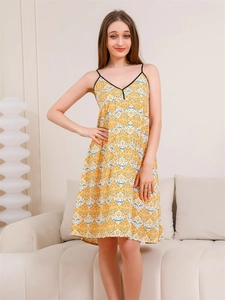 Detailed close-up of yellow floral V-neck lounge dress with ethnic print pattern