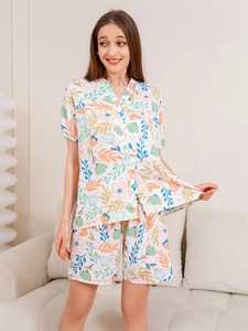 Close-up of floral print pajama set with V-neck button top and matching shorts