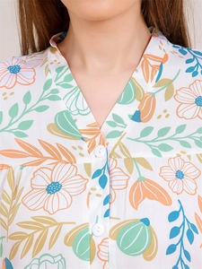 Detailed V-neck collar of women's floral pajama top with small white buttons