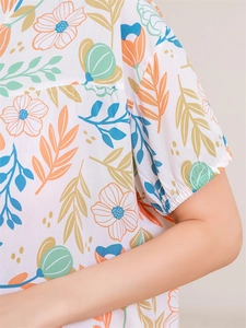 Close-up of floral rayon pajama top with elastic cuffs and vibrant summer prints