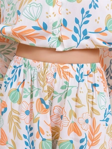 Detail of floral printed pajama top with buttons and elastic waistband summer fabric