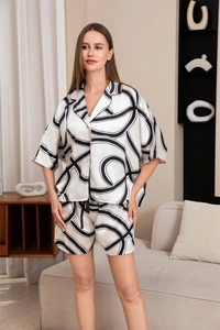 Vue détaillée d'un ensemble de pyjama en soie glacée avec imprimés abstraits noirs modernes