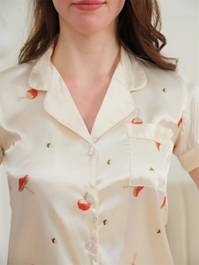 Detail of champagne ice silk pajama top with lapel collar and mushroom prints