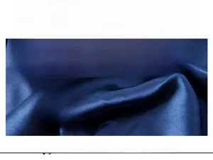 Detail of blue satin fabric showing smooth texture and breathable drape material