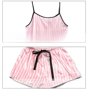 Detail of pink striped camisole and shorts with black trim and bow tie decoration