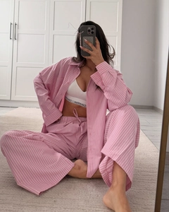 Close-up of pink striped pajama set with long sleeves and drawstring lounge pants