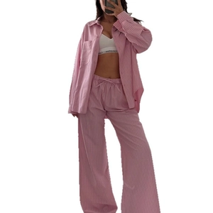 Women's pink and white striped loungewear set with long sleeve shirt and wide leg pants