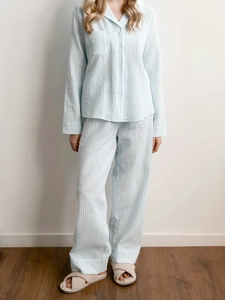 Detailed view of women's light blue striped cotton pajama set with shirt and long pants