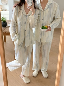 Close-up of cotton pajama set showing vertical wrinkled texture and blue stripe details