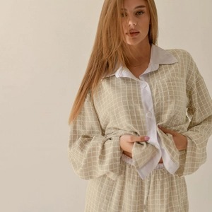 Women's plaid pajama set with long-sleeved button-down shirt and matching trousers