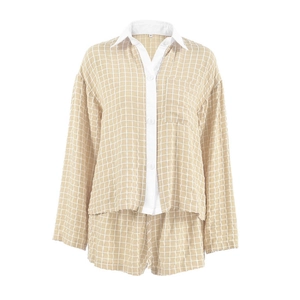 Women's khaki plaid pajama set with long sleeve button-up shirt and matching shorts