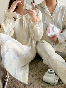 Detail of soft cotton crepe texture on yellow and blue striped couple pajamas