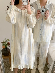 Detail of couple pajama set with ink splatter pattern and ruffled collar in cotton