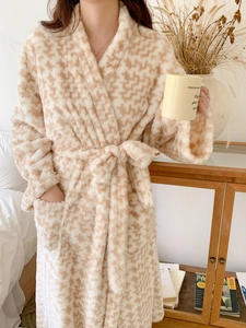 Detail of soft houndstooth fleece bathrobe showing the plush texture and waist tie