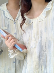 Close-up of cotton pajama collars showing artistic blue and grey brushstroke patterns