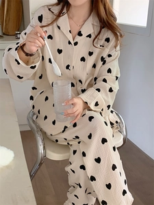 Detail of soft heart print cotton pajama set showing breathable gauze fabric texture