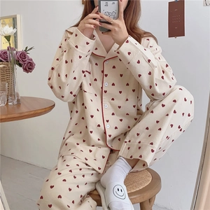 Women's heart print pajama set featuring a button-down lapel top and loose pants