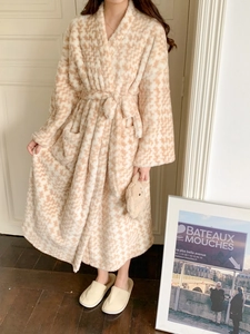 Detail of plush houndstooth bathrobe featuring soft texture and functional side pockets