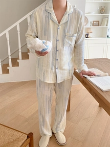 Close-up of men's cotton pajama set with artistic blue vertical stripes and chest pocket