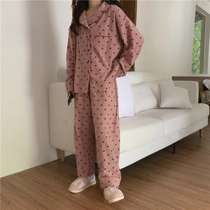 Detail of sweet heart pattern print on soft long sleeve pajamas with red piping
