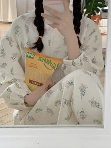 Detail of floral air cotton pajamas set featuring ruffled collar and elastic cuffs